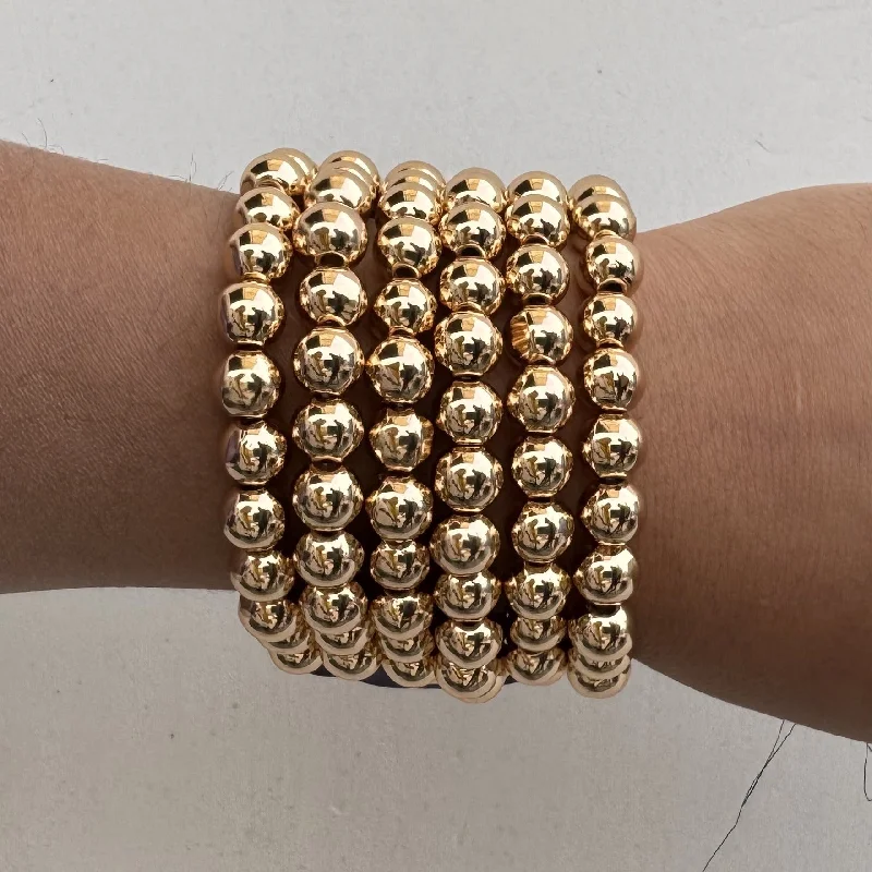 Modern geometric gold bracelets for women -TFC Round Bead Gold Plated Stacked Bracelet ( Set Of 6)